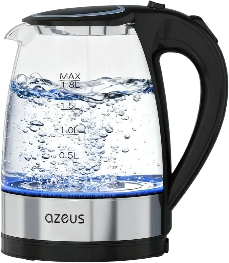 Hand lifting the AZEUS electric kettle by its handle while pouring hot water into a ceramic mug