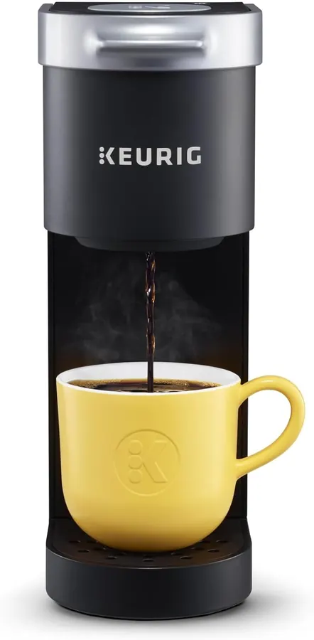 Keurig K-Mini coffee maker on a small counter next to a ruler showing its five-inch width
